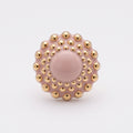Girándola Rosa Palo — vista frontal del anillo de porcelana rosa con bultos dorados brillantes y centro liso, sobre fondo blanco