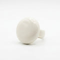 Esfera — anillo de porcelana blanca semiesférica sobre fondo blanco, vista lateral